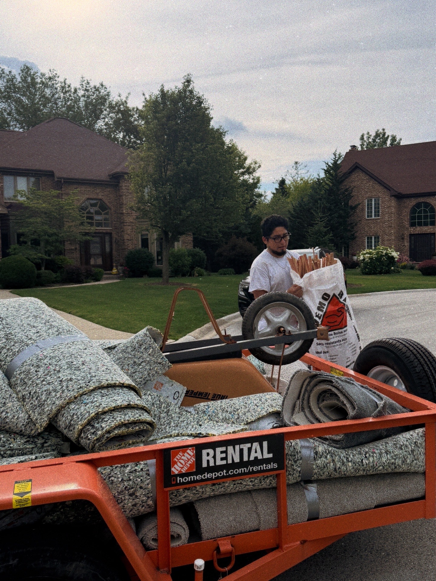 Carpet haul away Palatine Illinois — rolled basement carpet, padding and tack strips loaded for disposal