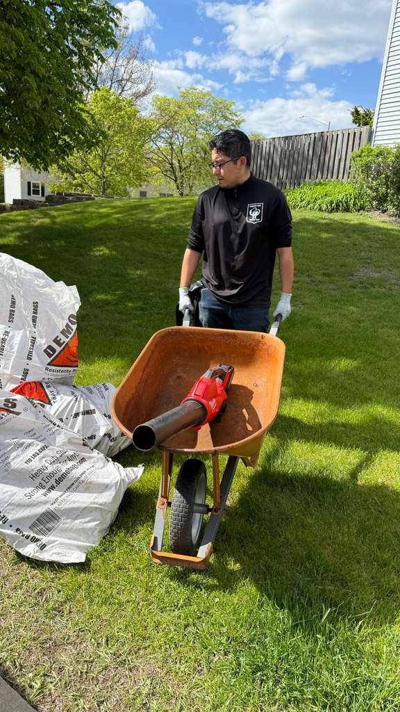 Wheelbarrow and demo bags on a Schaumburg job site