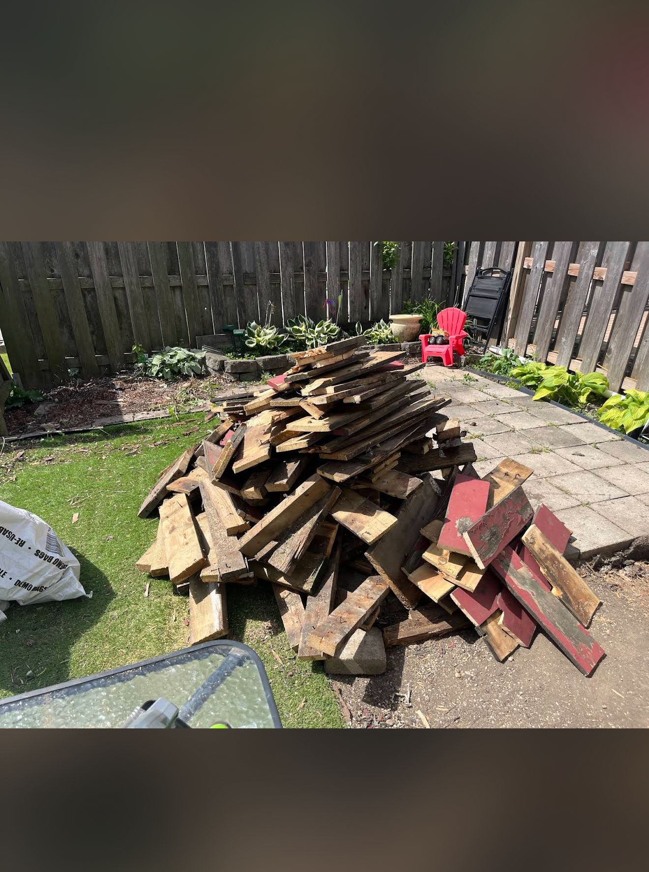 Stacked patio wood debris ready for haul-away in Schaumburg